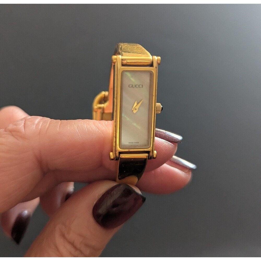 Vintage Gucci gold watch with mother of pearl dial 1500L with new battery.